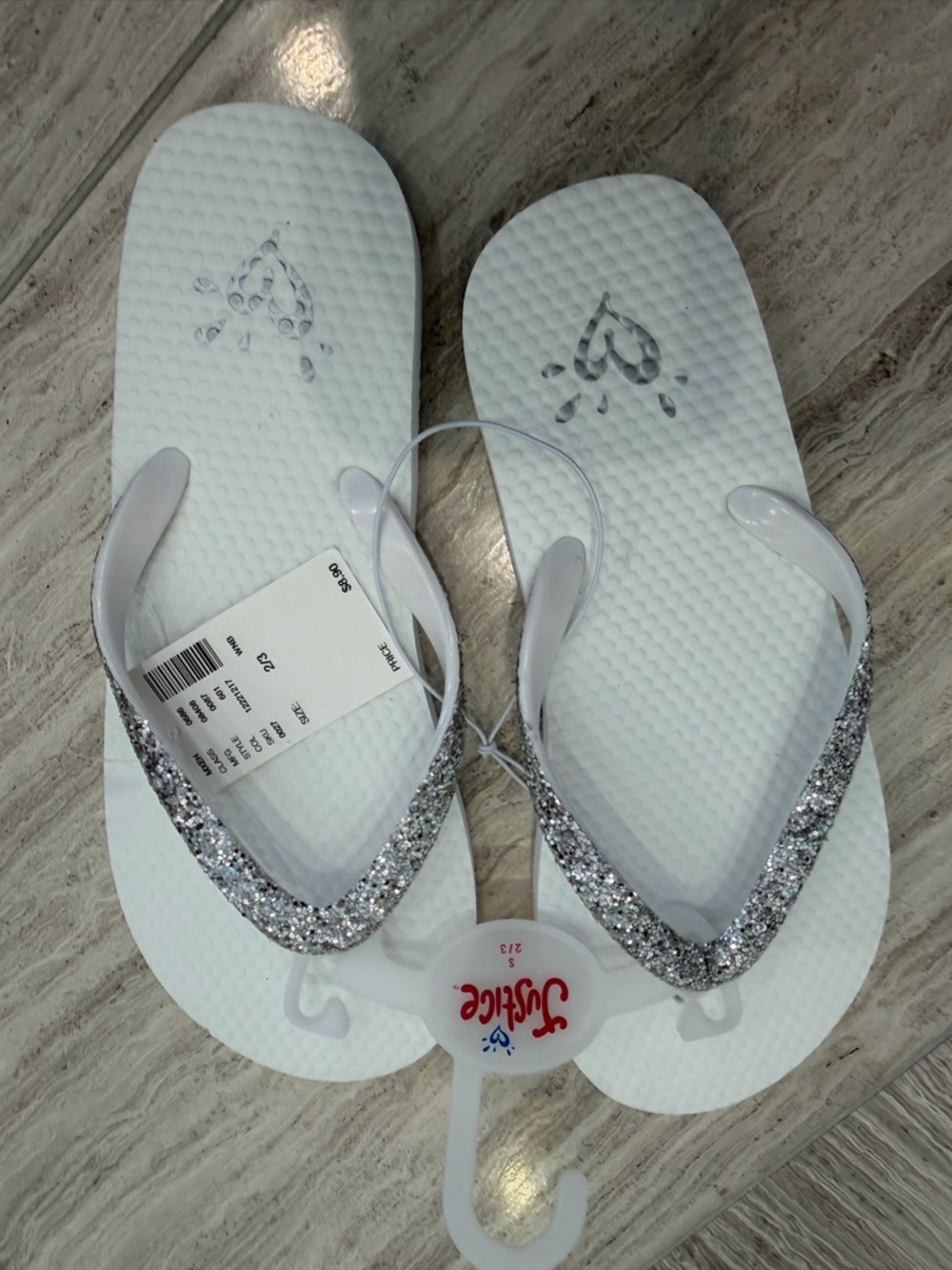 Girls Justice White Flip Flops with Silver Glitter Straps. Size 2/3